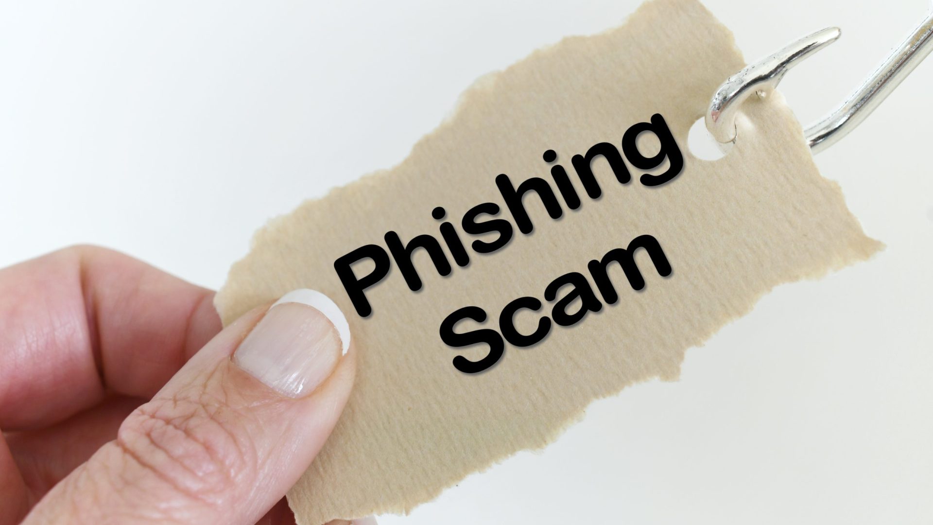 broszura z napisem phishing scam